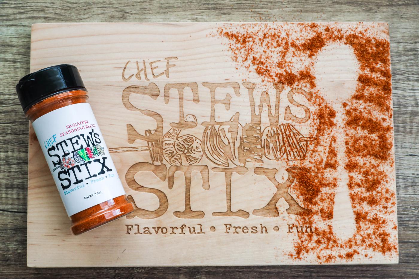 Seasoning powder dusted across Chef Stew's branded board